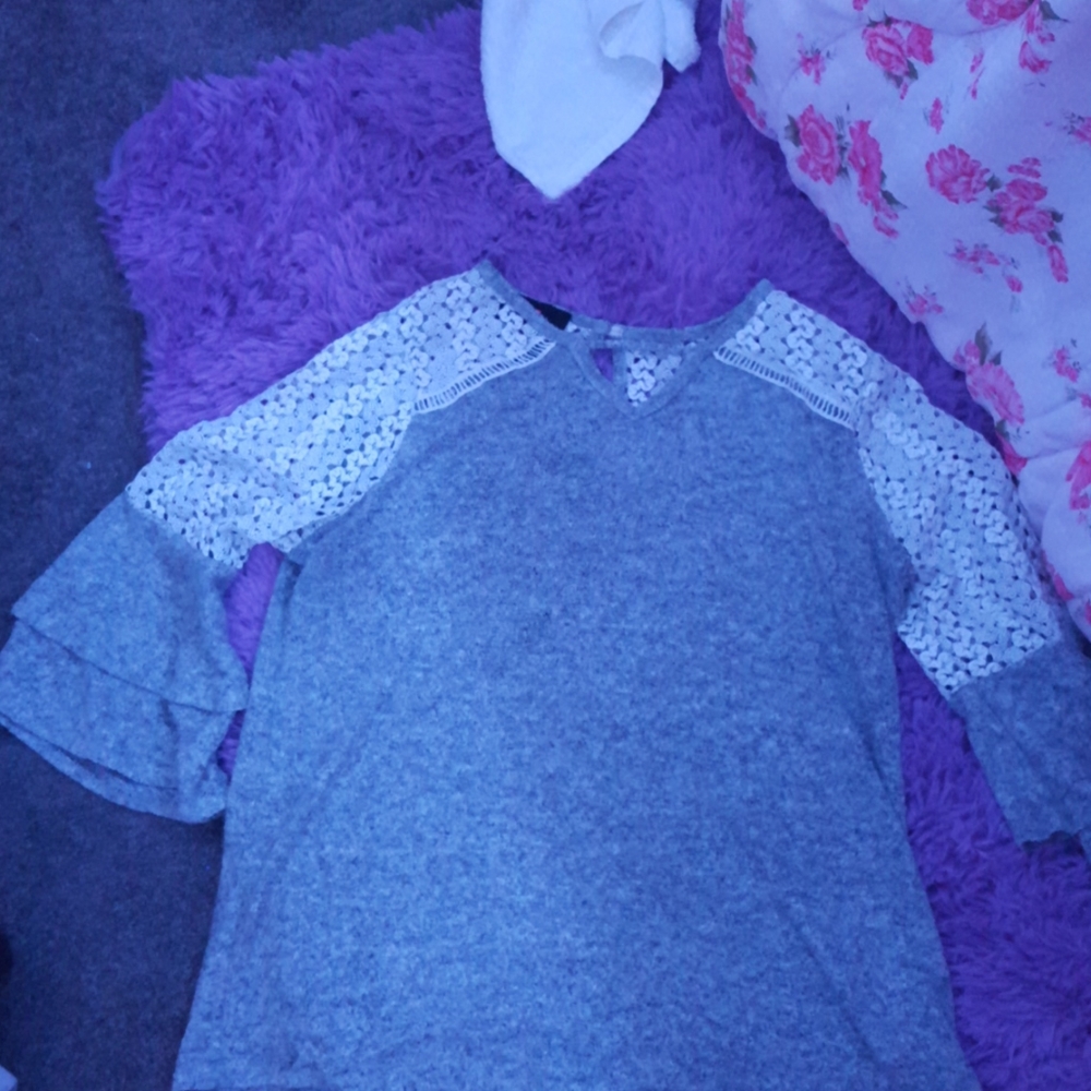 A gray and mesh bat winged shirt